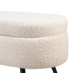 Metalen bank met witte krullen