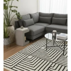 Rechthoekig katoenen tapijt met beige en zwarte motieven 90 x 60 cm